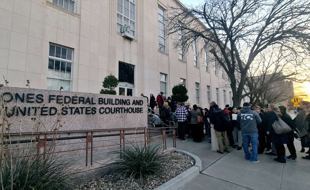People wait in line to enter the J Marvin Jones Federal Building and Courthouse in Amarillo, Texas, on March 15, 2023.