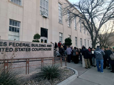 People wait in line to enter the J Marvin Jones Federal Building and Courthouse in Amarillo, Texas, on March 15, 2023.