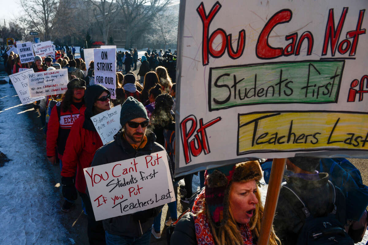 Denver teachers, students and community members picket outside South High School on February 11, 2019, in Denver, Colorado.