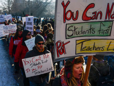 Denver teachers, students and community members picket outside South High School on February 11, 2019, in Denver, Colorado.