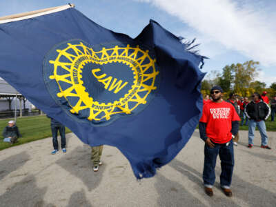 United Auto Workers union members and their families rally near the General Motors Flint Assembly plant on Solidarity Sunday on October 13, 2019, in Flint, Michigan.