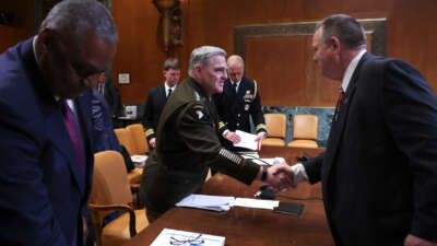 Sen. Jon Tester (right), chairman of the Senate Appropriations Subcommittee on Defense, with Chairman of the Joint Chiefs of Staff Gen. Mark Milley (center) and U.S. Secretary of Defense Lloyd Austin (left) after a hearing before the committee on May 3, 2022, in Washington, D.C.