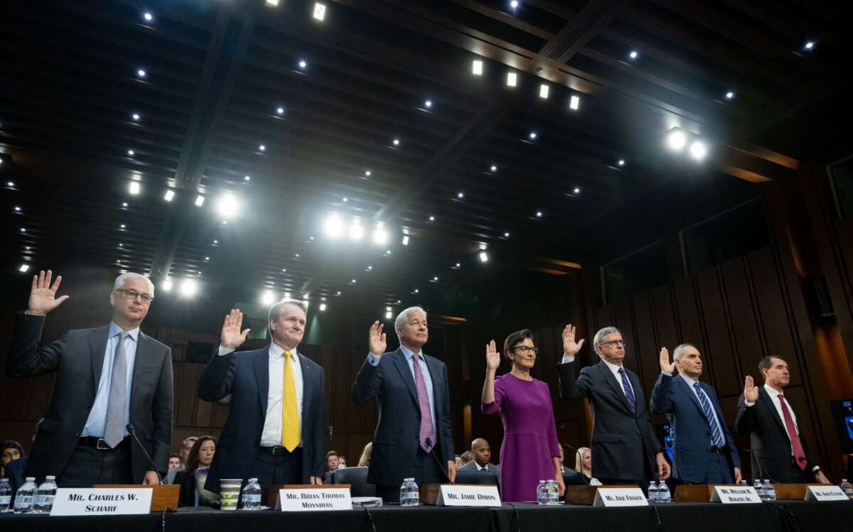 (L-R) Charles Scharf, CEO and President of Wells Fargo, Brian Thomas Moynihan, Chairman and CEO of Bank of America, Jamie Dimon, Chairman and CEO of JPMorgan Chase, Jane Fraser, CEO of Citigroup, William H. Rogers Jr., Chairman and CEO of Truist Financial Corporation, Andy Cecere, Chairman, President, and CEO of US Bancorp, and William Demchak, Chairman, President, and CEO, of The PNC Financial Services Group, are sworn in as they prepare to testify during a Senate Banking, Housing, and Urban Affairs Committee Hearing on the Annual Oversight of the Nation's Largest Banks, on Capitol Hill in Washington, DC, September 22, 2022.