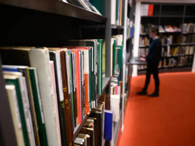 A woman stands at the digital research portal in the Central Library of the Municipal Libraries in the Palace of Culture in Dresden, Germany on February 27, 2023.