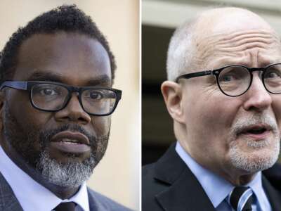 Mayoral candidates Cook County Commissioner Brandon Johnson, left, and former Chicago Public Schools CEO Paul Vallas campaign in Chicago in February, 2023.