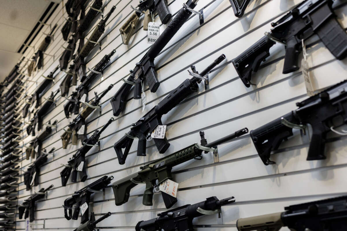 A selection of AR-15-style rifles hangs on a wall at R-Guns store on January 11, 2023, in Carpentersville, Illinois.