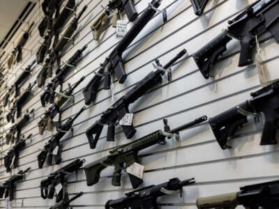 A selection of AR-15-style rifles hangs on a wall at R-Guns store on January 11, 2023, in Carpentersville, Illinois.