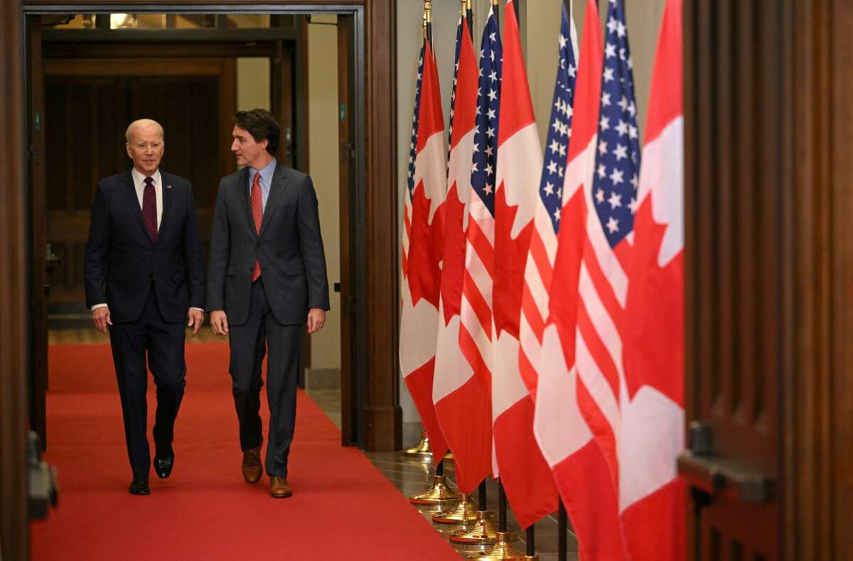 Canada's Prime Minister Justin Trudeau (R) walks with U.S. President Joe Biden after welcoming him at Parliament Hill in Ottawa, Canada, on March 24, 2023.