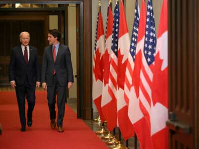 Canada's Prime Minister Justin Trudeau (R) walks with U.S. President Joe Biden after welcoming him at Parliament Hill in Ottawa, Canada, on March 24, 2023.
