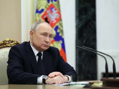 Russian President Vladimir Putin attends a meeting at the Kremlin in Moscow on March 25, 2023.