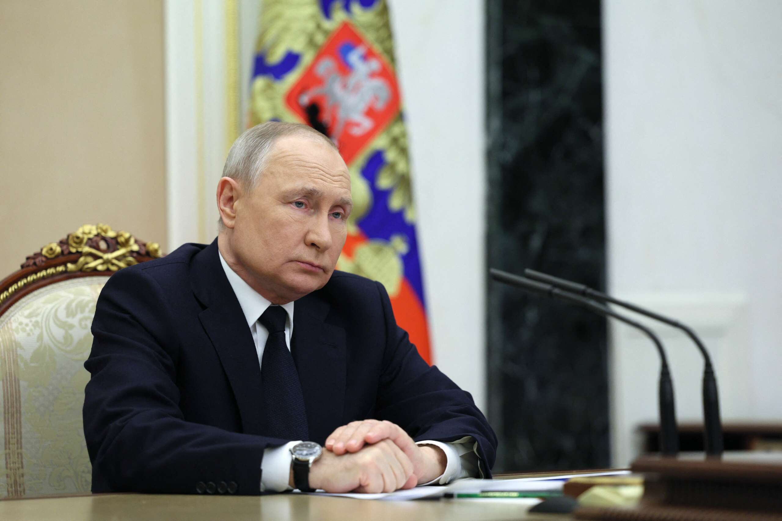 Russian President Vladimir Putin attends a meeting at the Kremlin in Moscow on March 25, 2023.