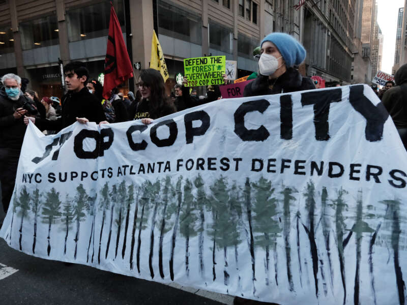Activists participate in a protest against the proposed Cop City being built in an Atlanta forest on March 9, 2023 in New York City.