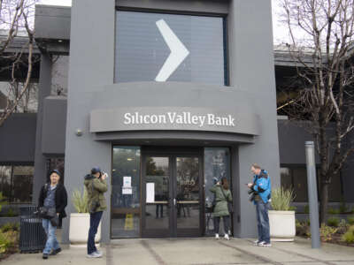 Media staff report in front of the headquarters of Silicon Valley Bank on March 10, 2023 in Santa Clara, California.