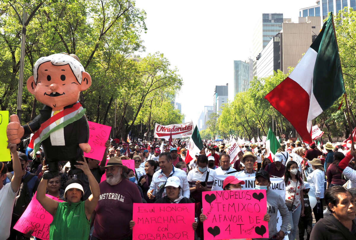 A crowd of supporters of Mexican President Andrés Manuel López Obrador march down Mexico City’s Paseo de la Reforma during a demonstration to celebrate his government’s accomplishments in the four years since the start of his presidency, November 27, 2022.