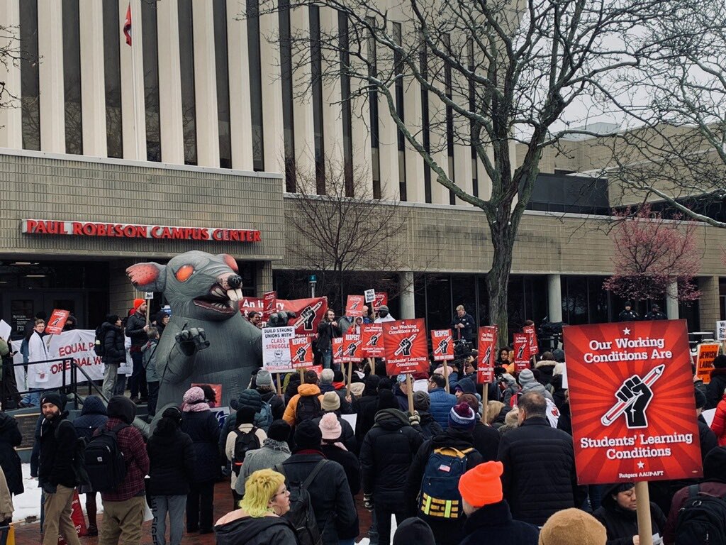 'Our working conditions are students’ learning conditions,' reads a sign at the Rutgers workers’ rally outside the Board of Governors meeting in Newark, New Jersey, on February 28, 2023.