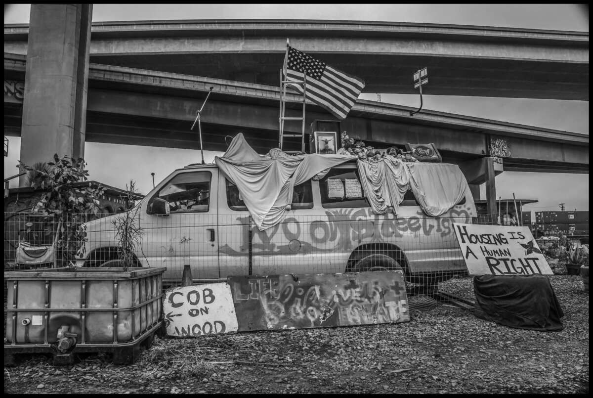 The Wood Street encampment of unhoused people under a freeway and railroad overpass was home to over 300 people, who the city and CalTrans forced to leave. Volunteers helped residents try to resist eviction.