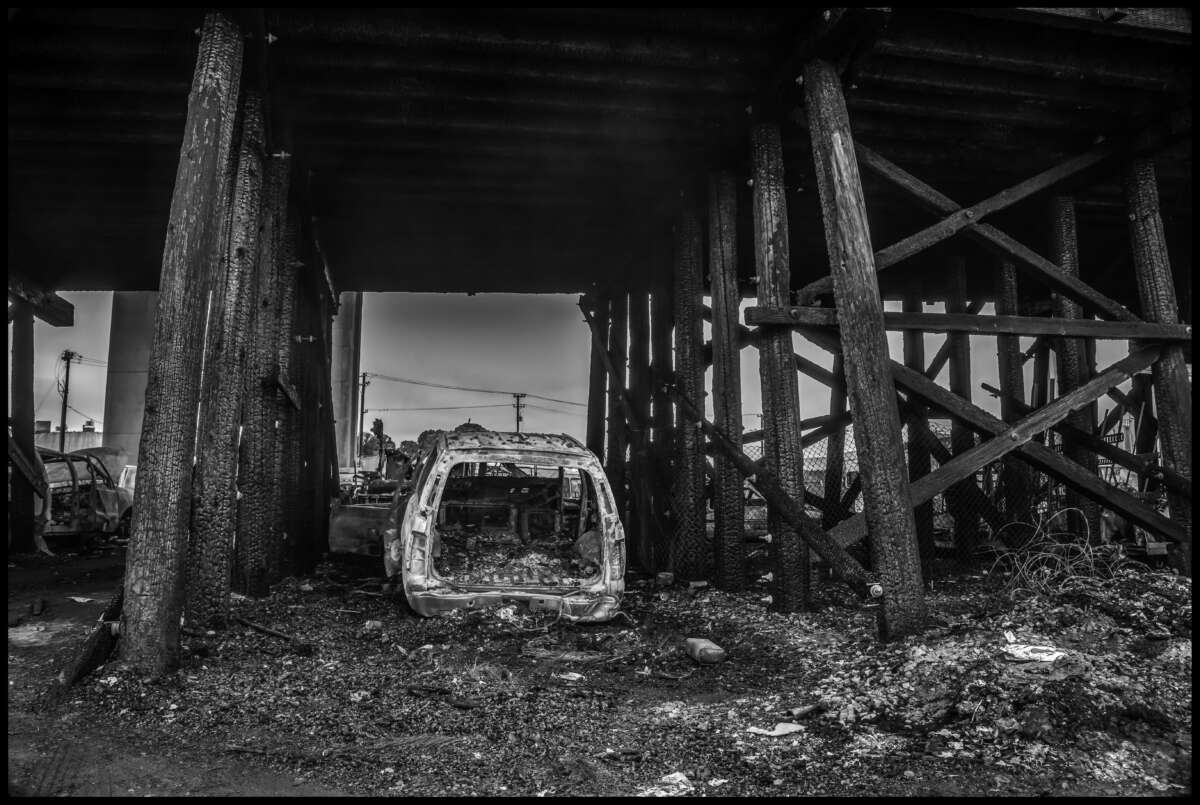 A car burned in the last big fire. When cars were burning CalTrans had to close the freeway above.