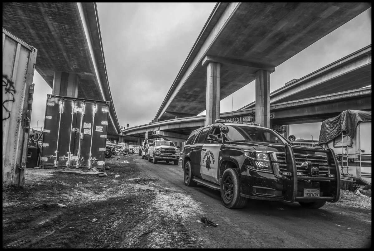 The Highway Patrol escorted in workers to clear part of the encampment.