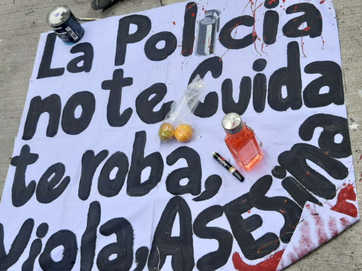 A banner that says “the police don’t take care of you, they rob, rape, and kill you” dries during an anti-militarist protest on December 10, 2022, in Plaza La Merced, Tegucigalpa, Honduras.