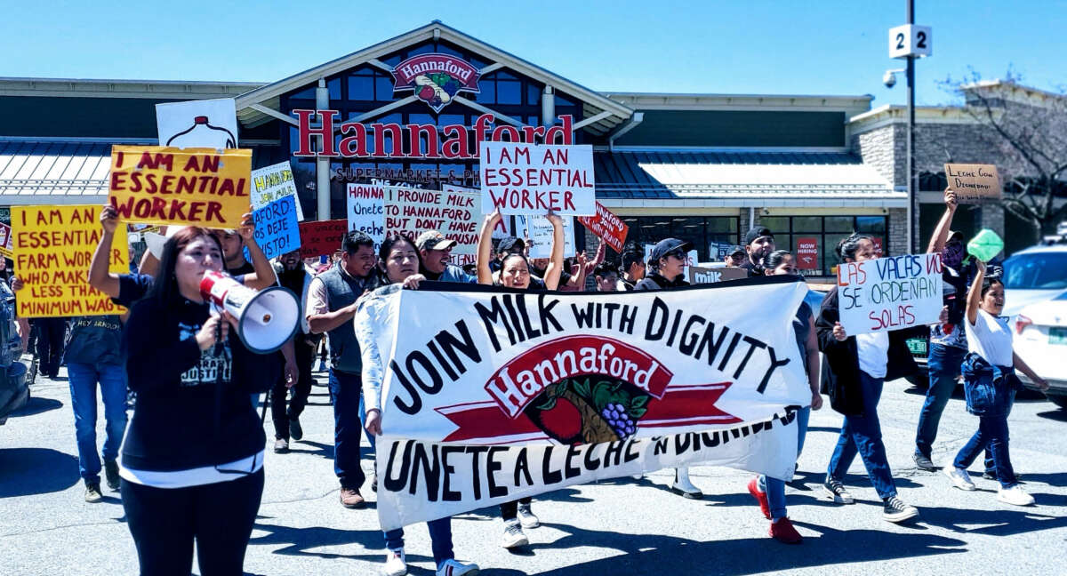 Farm workers march on a Hannaford Supermarket in Middlebury, Vermont, demanding “Milk with Dignity,” on May 1, 2022.