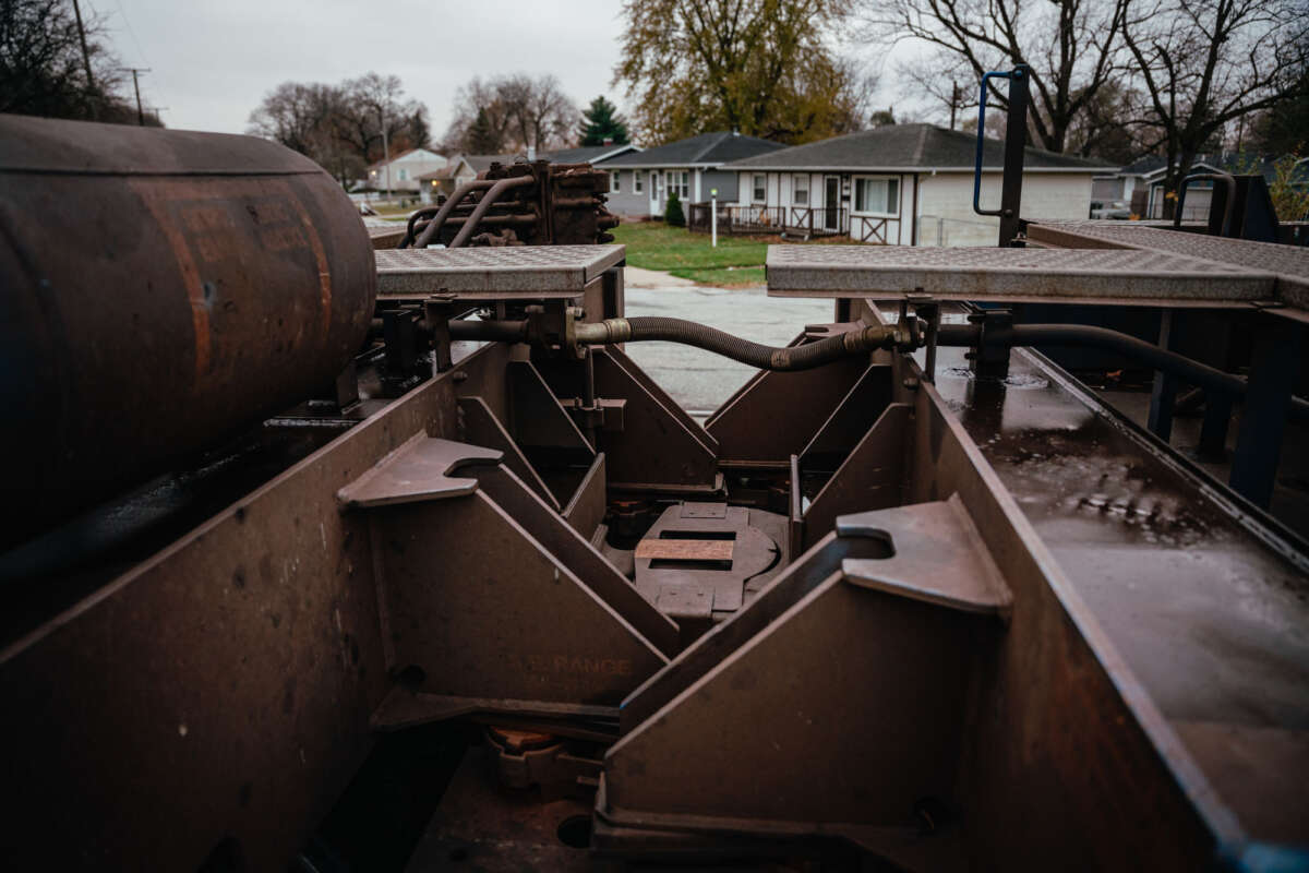 A coupler connects the freight cars of a train parked in Hammond.