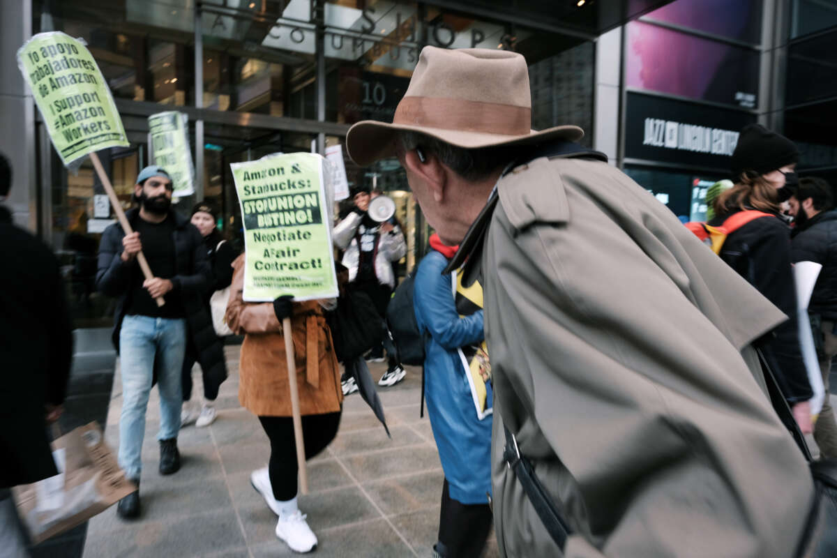 Members of the Amazon Labor Union and others protest outside of the New York Times DealBook Summit on November 30, 2022, in New York City.