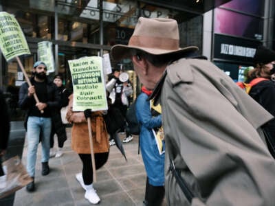 Members of the Amazon Labor Union and others protest outside of the New York Times DealBook Summit on November 30, 2022, in New York City.
