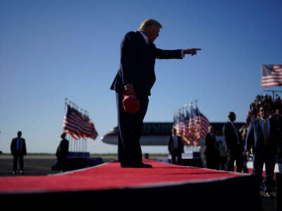 Former president Donald Trump arrives for a campaign rally at Waco Regional Airport in Waco, Texas, on March 25, 2023.