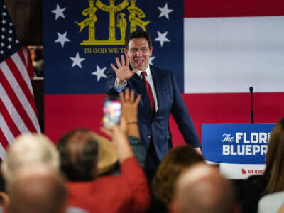Florida Gov. Ron DeSantis greets attendees as he arrives at an event on his nationwide book tour, at Adventure Outdoors, the largest gun store in the country, on March 30, 2023, in Smyrna, Georgia.