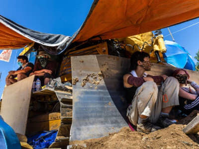 Environmental activists chain themselves to construction equipment at a Line 3 pipeline pumping station near Itasca State Park, Minnesota, on June 7, 2021.