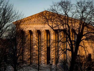 The U.S. Supreme Court is illuminated by the setting sun in Washington, D.C., on December 21, 2022.