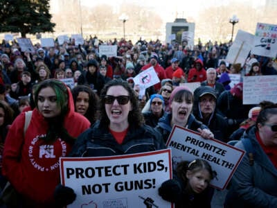 DPS teacher Callie Ludwig, front, and hundreds of Colorado educators and students demanded that elected leaders take action to keep schools safe during Show Up to End Gun Violence rally at Colorado State Capitol in Denver, Colorado, on March 24, 2023.