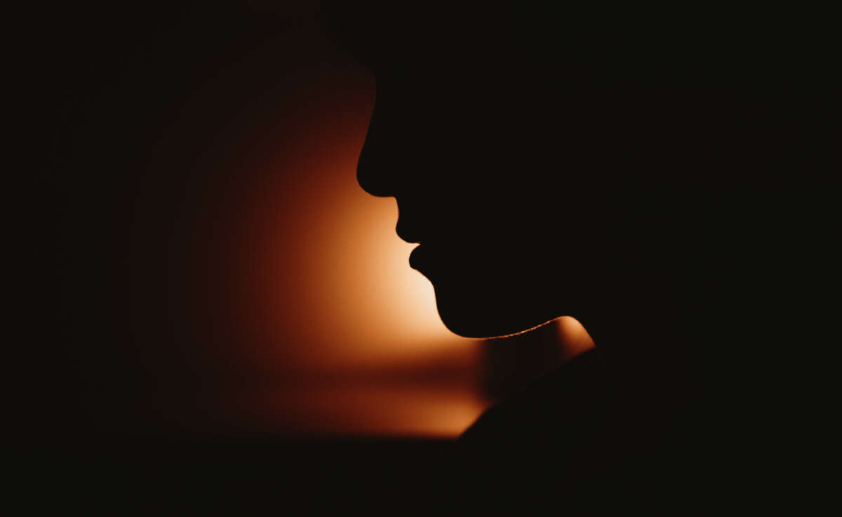 Person's face in silhouette