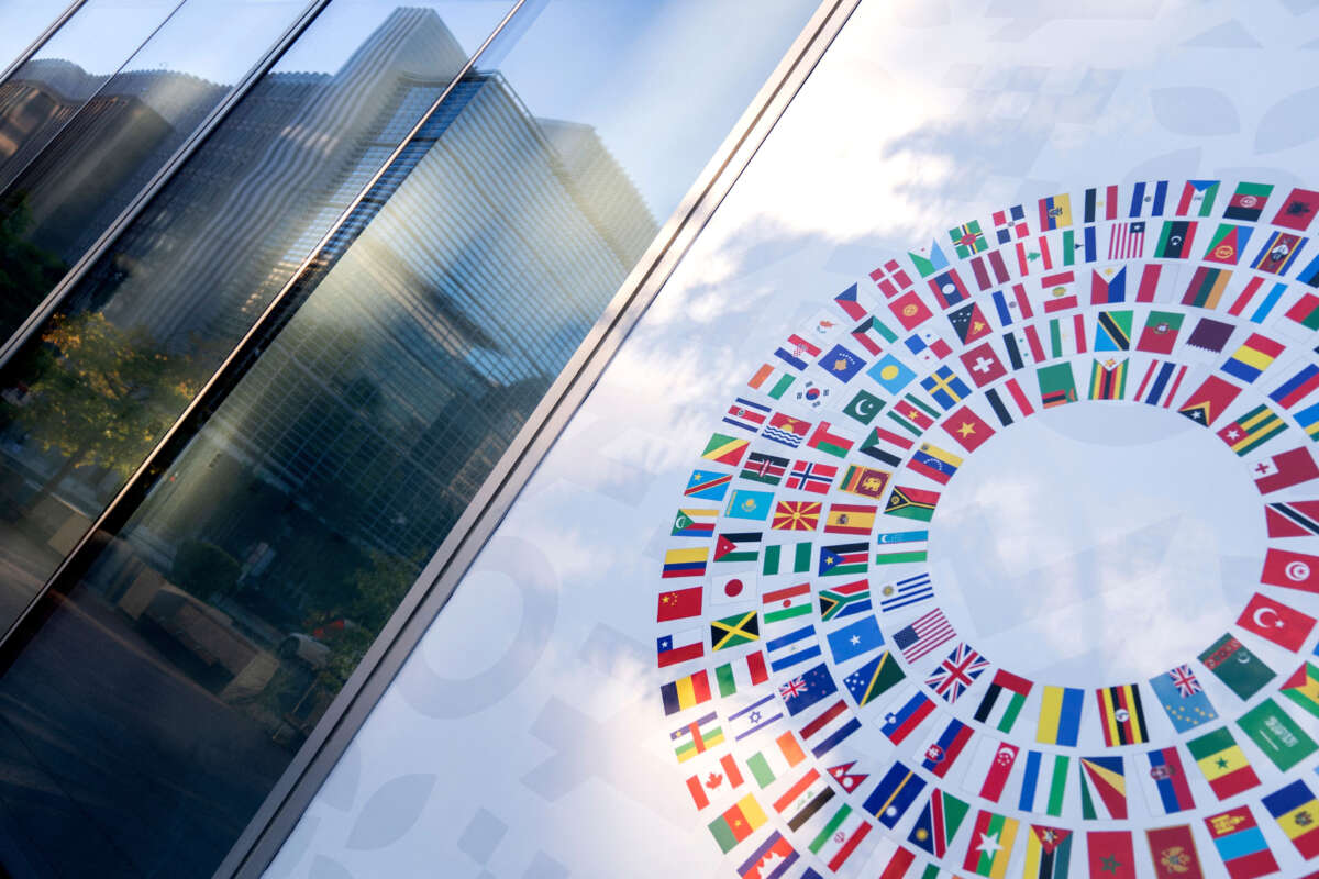 World Bank headquarters seen reflected in a window of the International Monetary Fund headquarters in Washington, D.C., on October 8, 2022.