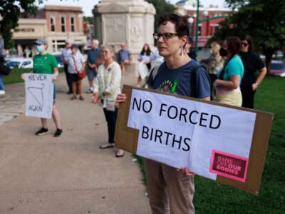 Abortion rights activists gather at the Monroe County Courthouse for a protest vigil a few hours before Indiana's near total abortion ban goes into effect in Bloomington on September 15, 2022.