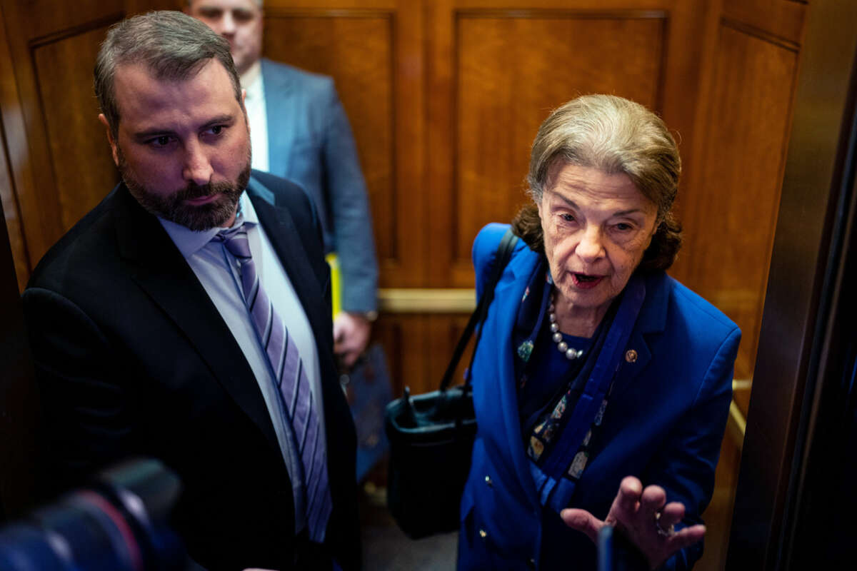 Sen. Dianne Feinstein speaks to members of the press as she boards an elevator