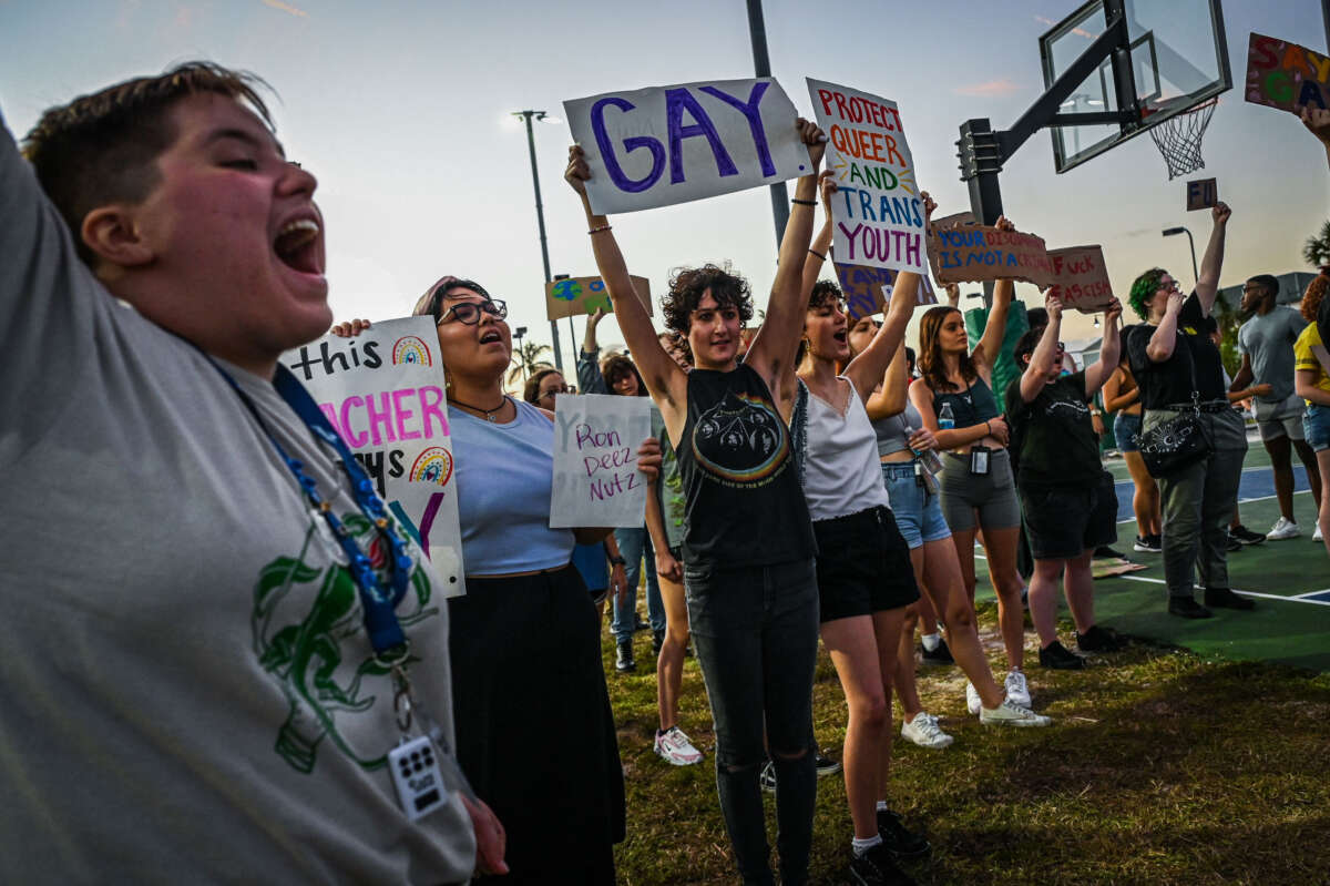 LGBTQ rights supporters protest against Florida Governor Ron Desantis outside a campaign event on November 6, 2022, in Fort Myers, Florida.