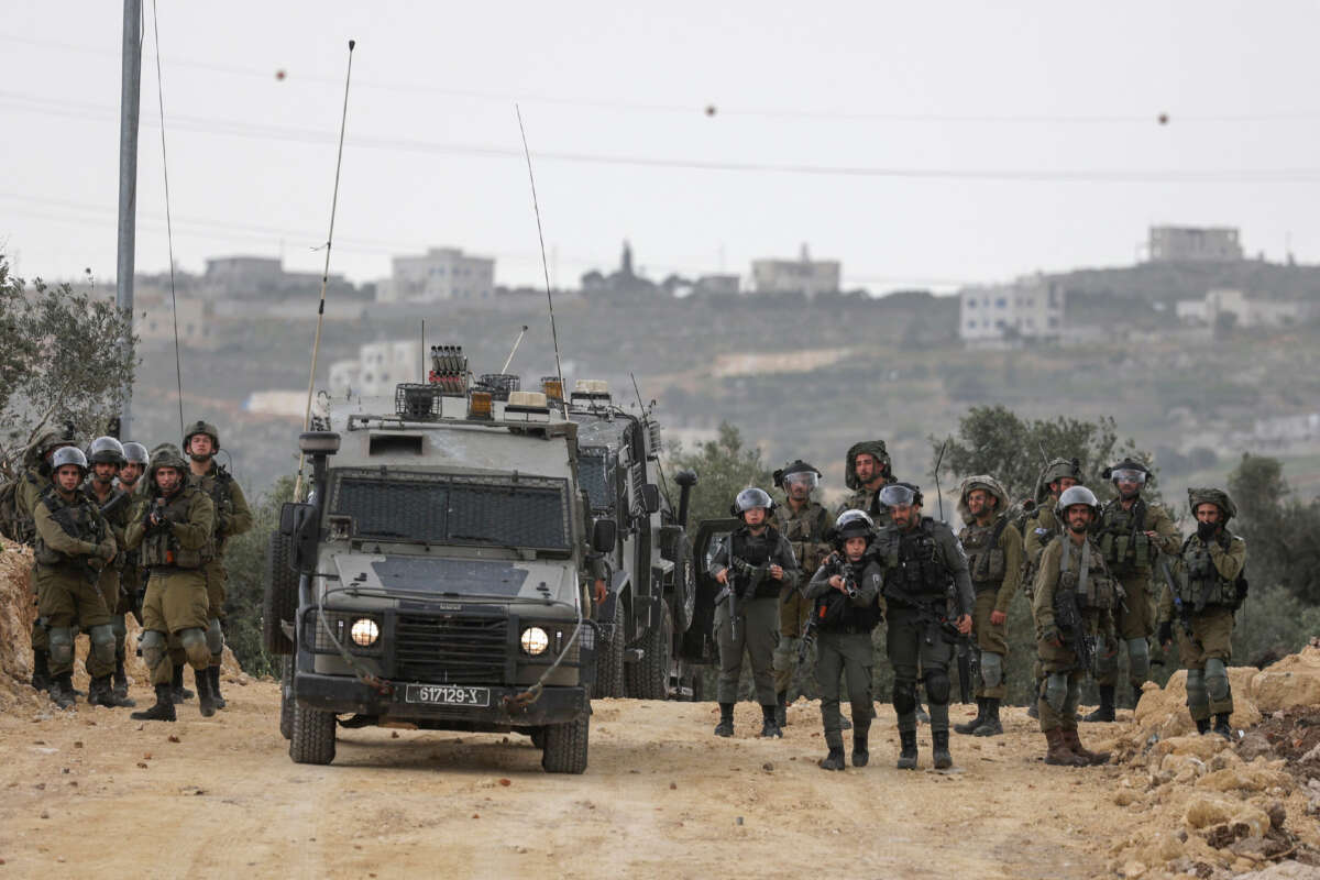Israeli security forces take aim at Palestinians demonstrating in the village of Beita, south of Nablus in the occupied West Bank, on April 10, 2023, against a march by settlers to the nearby Israeli outpost of Eviatar.