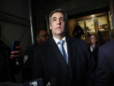 Former Donald Trump lawyer Michael Cohen walks out of a Manhattan courthouse after testifying before a grand jury on March 13, 2023, in New York City.