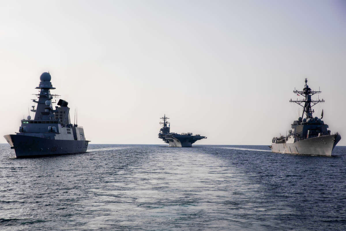 The guided missile destroyer USS Delbert D. Black, right, the aircraft carrier USS George H.W. Bush, center, and Italian Navy destroyer ITS Caio Duilio sail in formation in the Adriatic Sea on February 24, 2023.