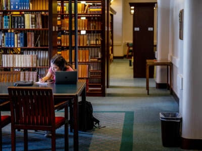 A student studies in a library