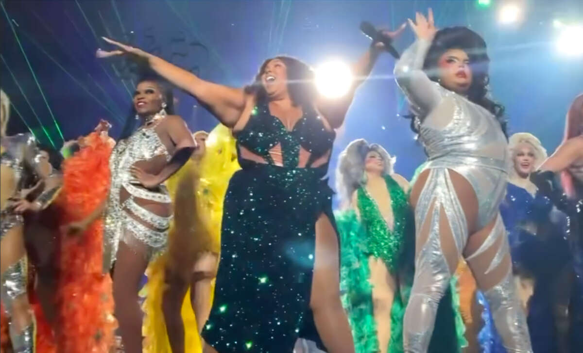 Lizzo is joined by drag queens onstage during her concert in Knoxville, Tennessee.
