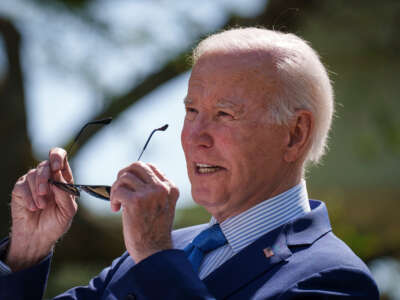 President Joe Biden puts on his sunglasses as he speaks before signing an executive order that would create the White House Office of Environmental Justice, in the Rose Garden of the White House on April 21, 2023, in Washington, D.C.