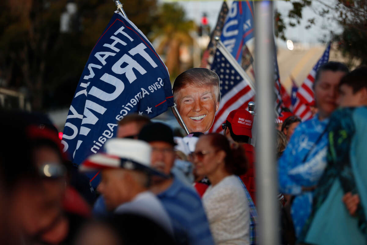 Supporters of former President Donald Trump gather near his residence at the Mar-a-Lago Club on April 4, 2023, in West Palm Beach, Florida.