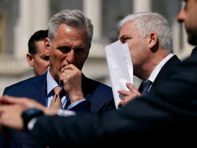 House Speaker Kevin McCarthy (left) listens to Majority Whip Don Emmer during an event to celebrate the House passing an anti-trans school sports bill outside the U.S. Capitol on April 20, 2023, in Washington, D.C.