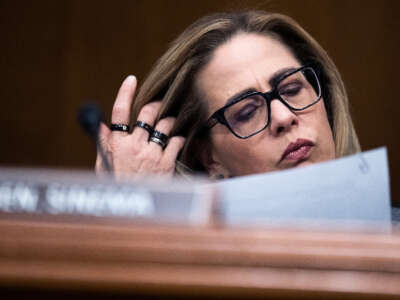 Sen. Kyrsten Sinema attends a Senate Homeland Security and Governmental Affairs Committee markup in Dirksen Building on March 15, 2023.