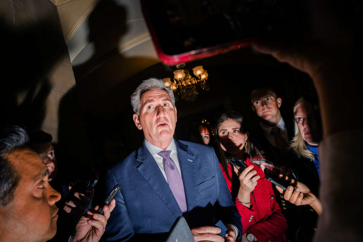 Sen. Kevin McCarthy is grilled by reporters as one shines a smartphone flashlight directly into his face