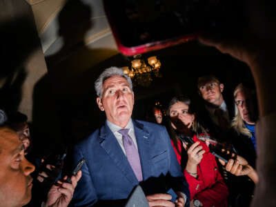 Sen. Kevin McCarthy is grilled by reporters as one shines a smartphone flashlight directly into his face