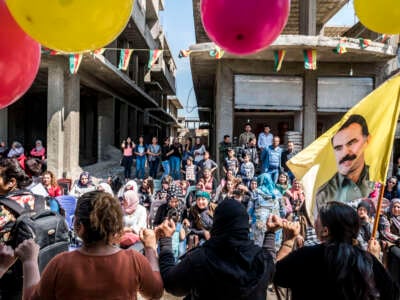 Women gather for a celebration in Rojava, Autonomous Administration of North and East Syria, on August 22, 2017.