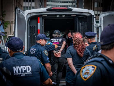 A protester seen getting arrested for blocking the street during a direct action outside New York City Hall to call out Mayor Bill de Blasio's record on homelessness on July 20, 2021, in New York City.